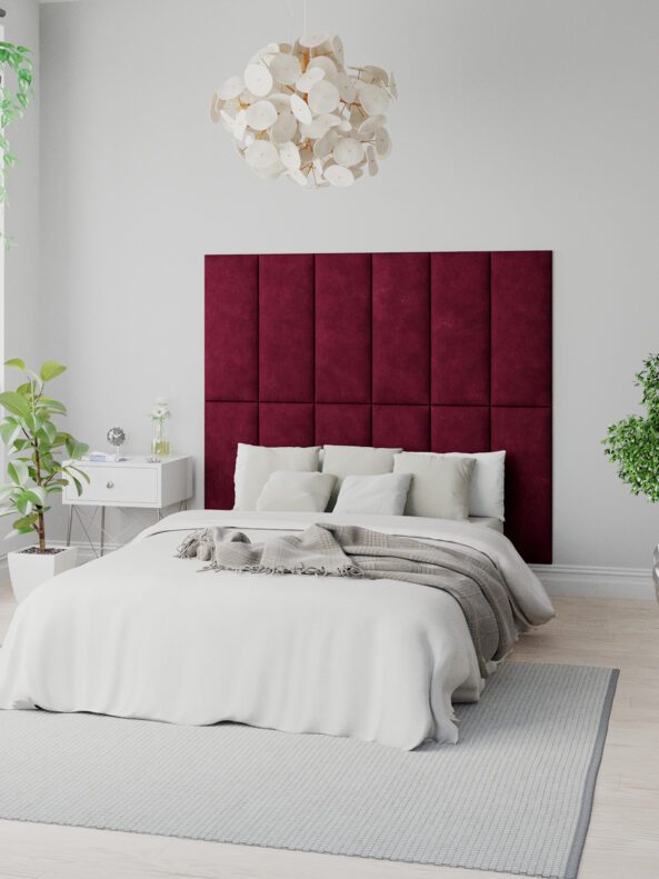 Bed with red Aspire panels acting as a headboard