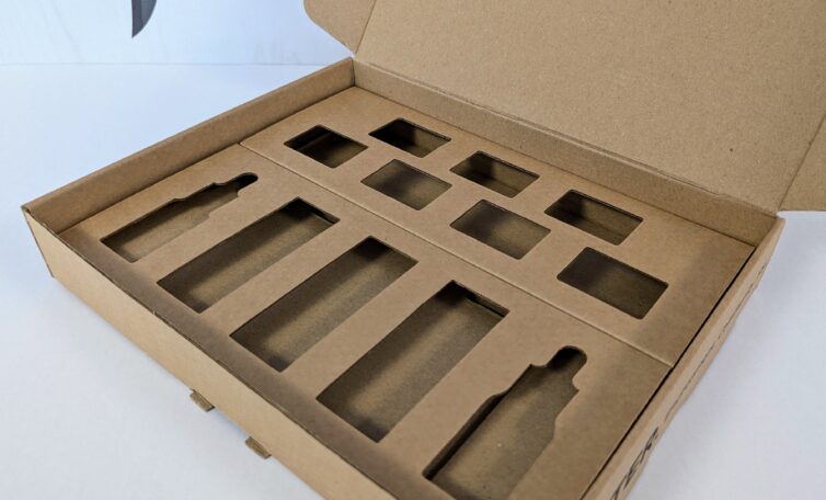 An open Greyhound Box corrugated cardboard box with bespoke internal fitments for Orean