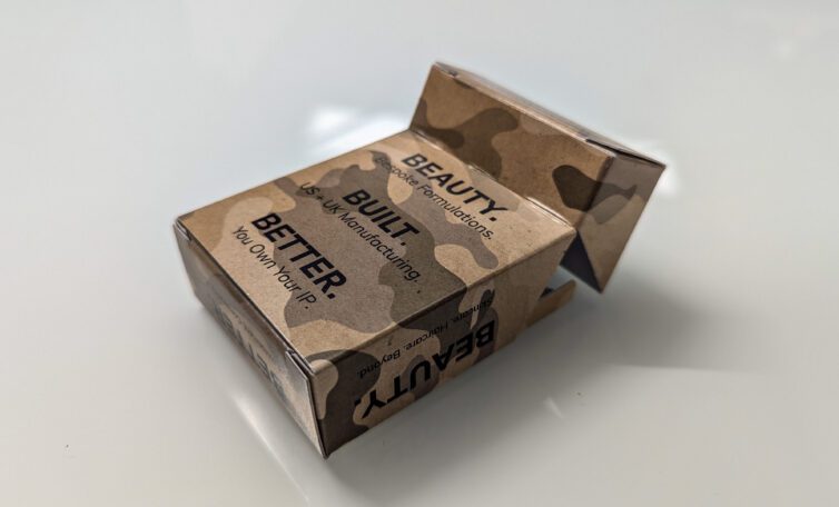 The back of a camouflage carton for Orean’s ‘Survival Kit’ featuring a self-locking, bespoke packaging design