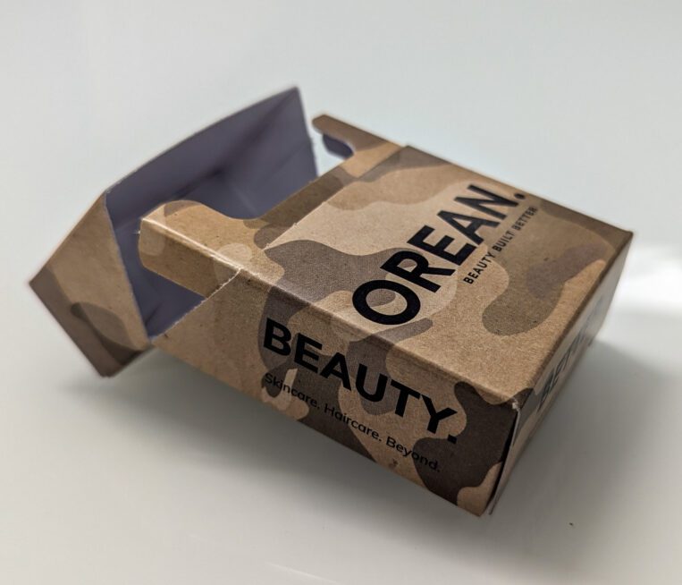 An open camouflage carton for Orean’s ‘Survival Kit’ beauty packaging featuring a self-locking, bespoke box design