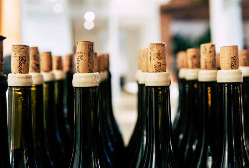 Close up of glass wine bottles with corks in the top