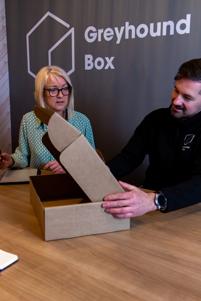 Two Greyhound Box team members reviewing the functionality of a bespoke packaging design